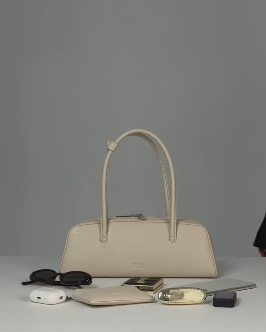 Jenny packing the Mercer Bag Oat Croc 